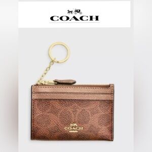 Coach Mini Skinny Id Case
In Signature Canvas. Gold/Brown/Copper. #CCS50. NWOT